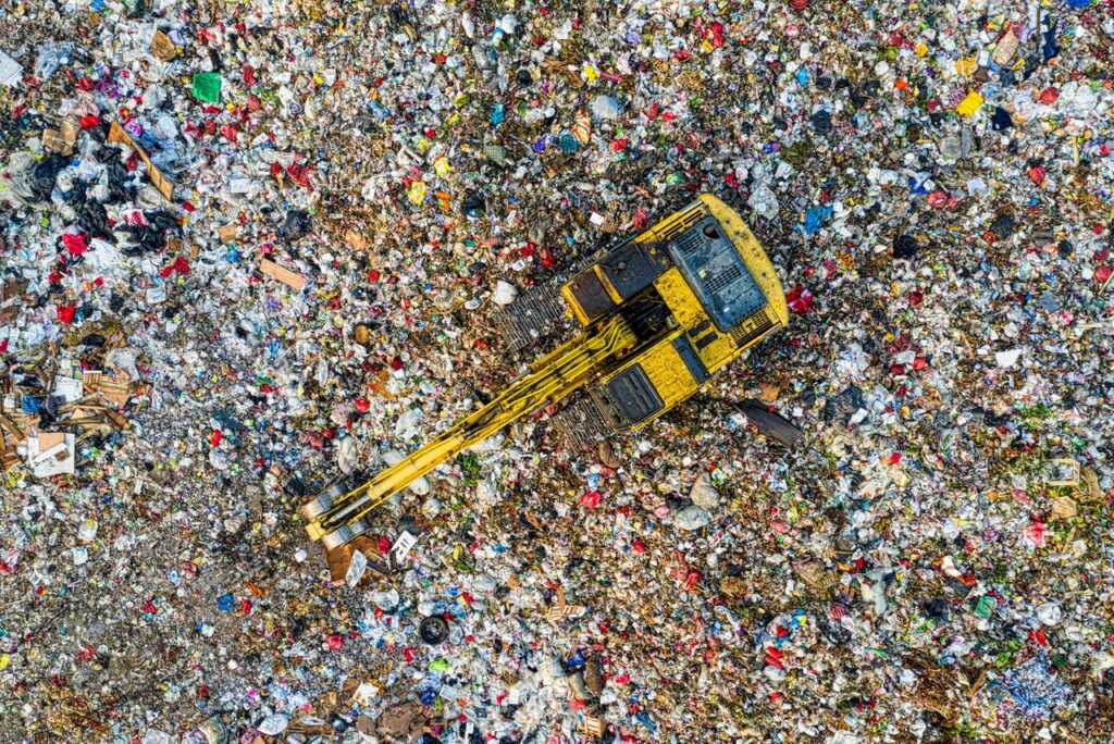 A bird's eye view of a landfill site with machinery 