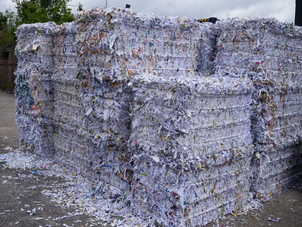stacks of shredded waste paper bales