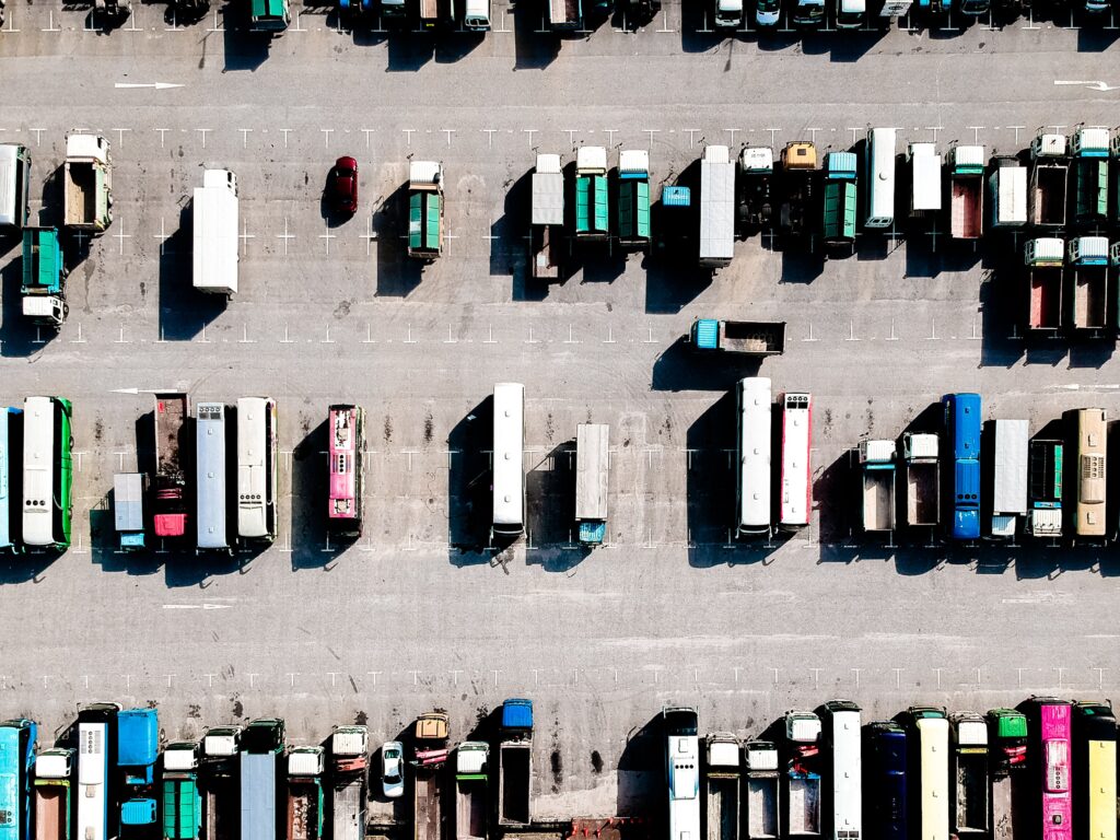 aerial view of trucks and lorries parked in a carpark.
