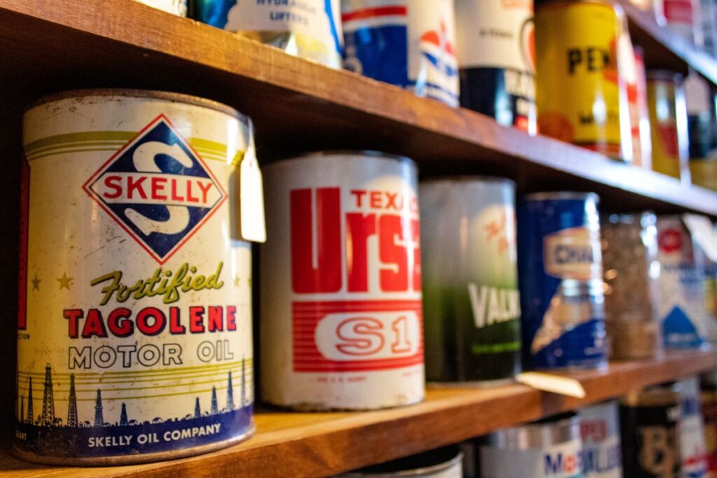 Vintage style paint cans on a shelf in a shop