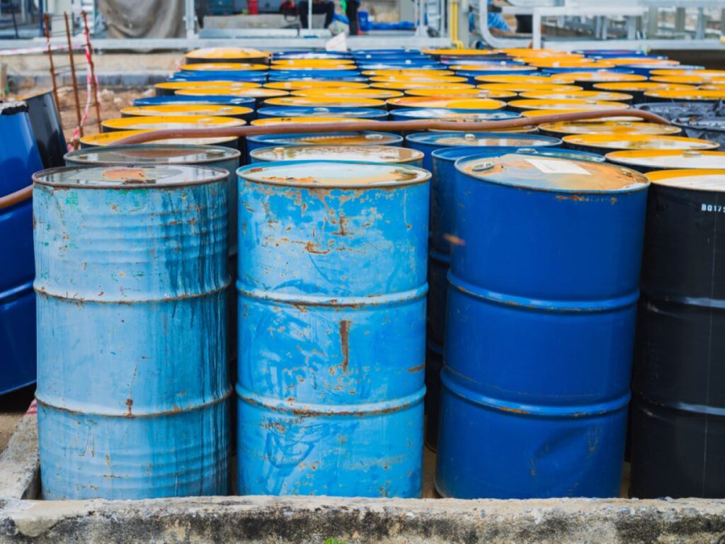 lines of storage drums containing hazardous waste