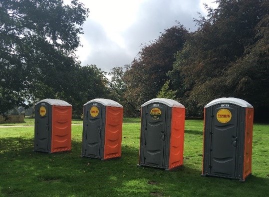 portable toilets in a field 