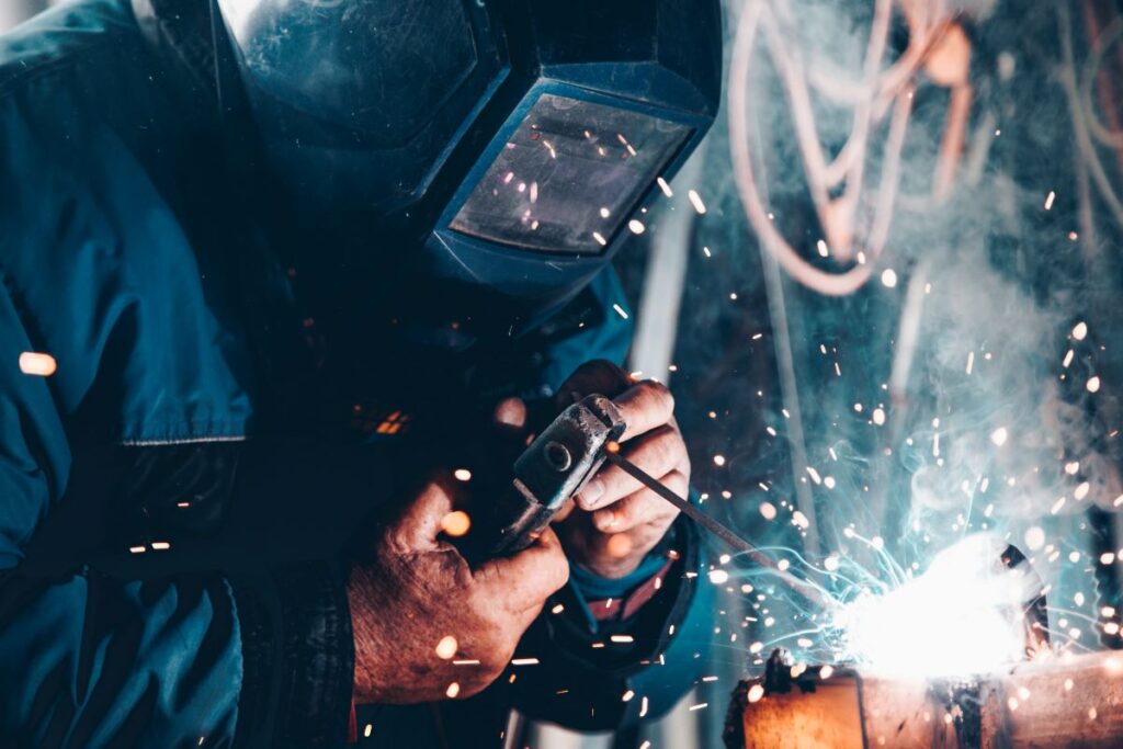 A man welding and doing engineering work