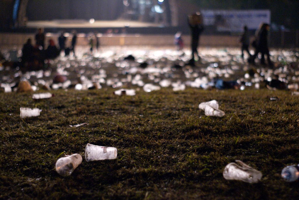 Festival litter in front of a festival stage