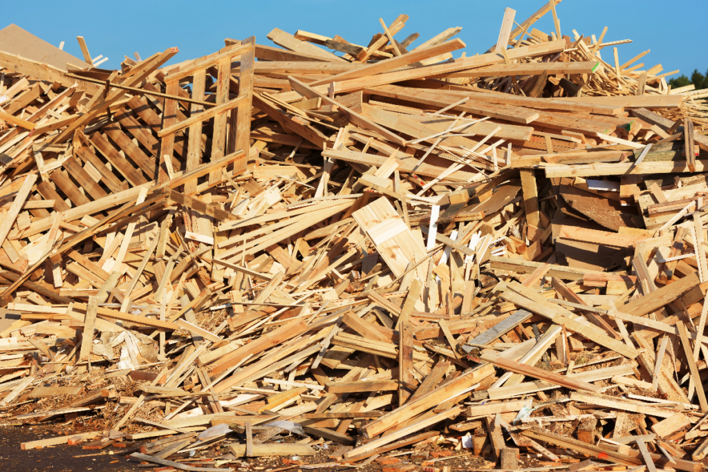 A pile of wood waste and broken pallets
