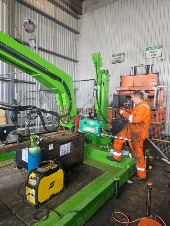 Engineer repairing waste equipment